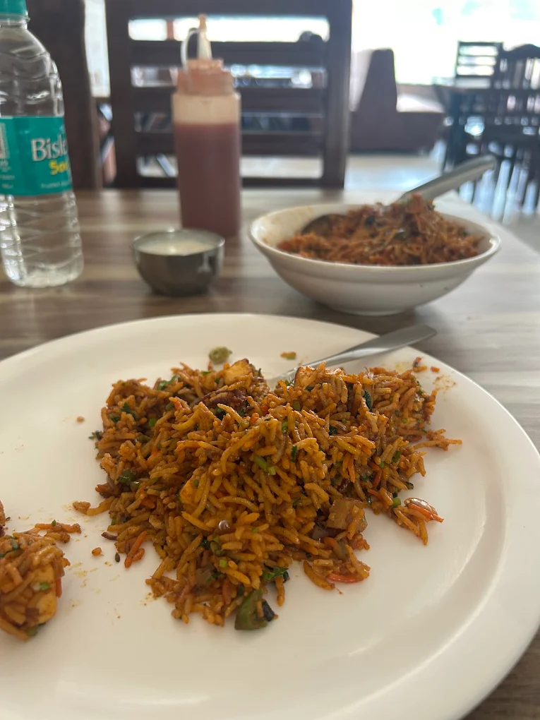 A plate of spicy schezwan veg fried rice